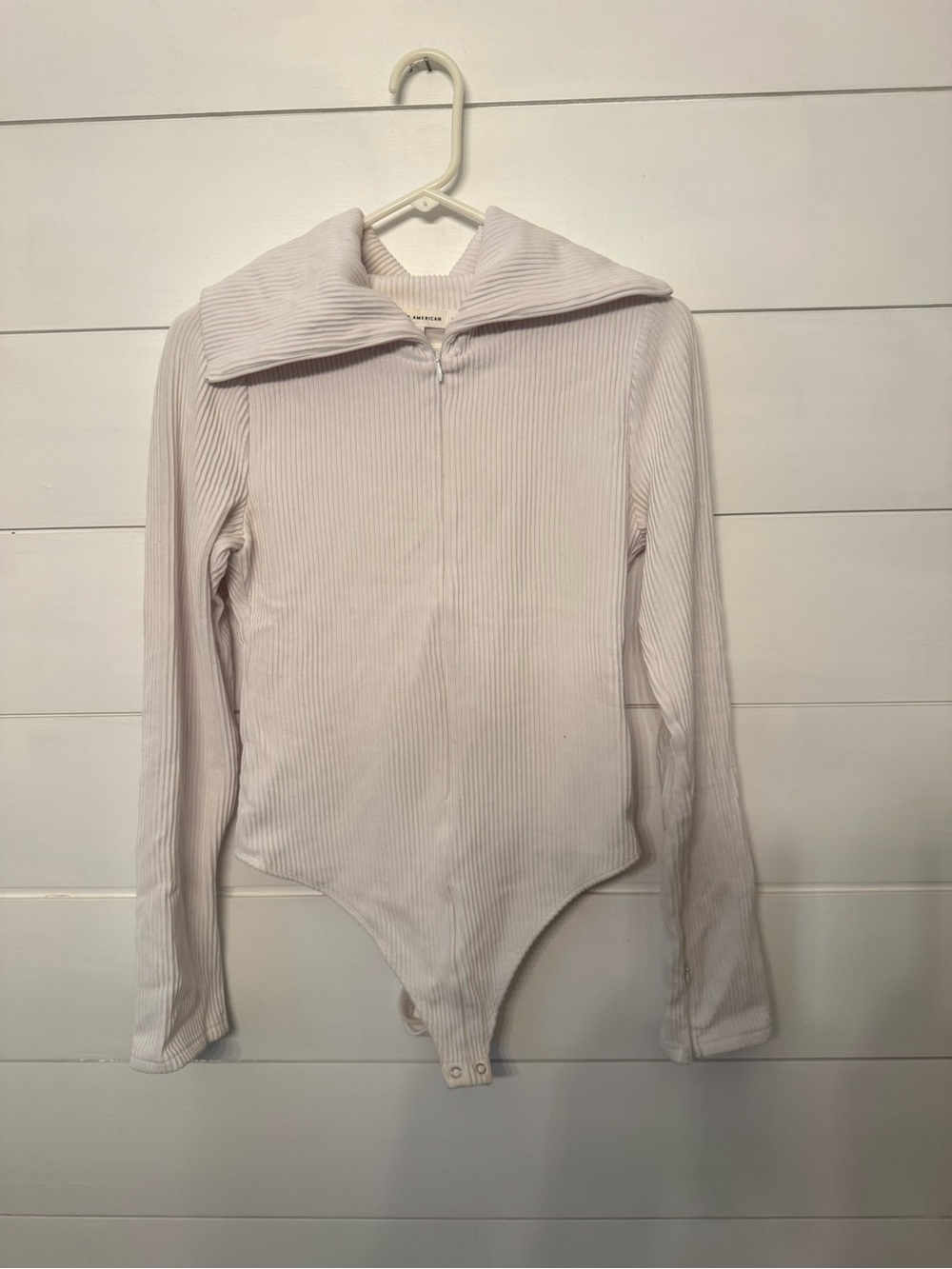 Good American Ribbed Zip-Front Long Sleeve Bodysuit in Pale Pink